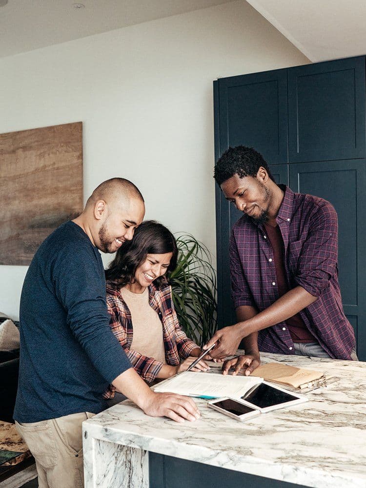 Family reviewing property details with agent
