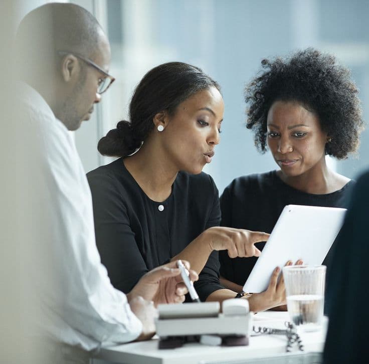 Agents reviewing property on tablet